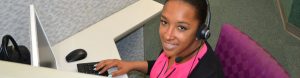 Female African-American TeleRep Operator Smiling at Camera