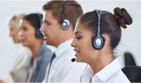 team of call center agents with headsets